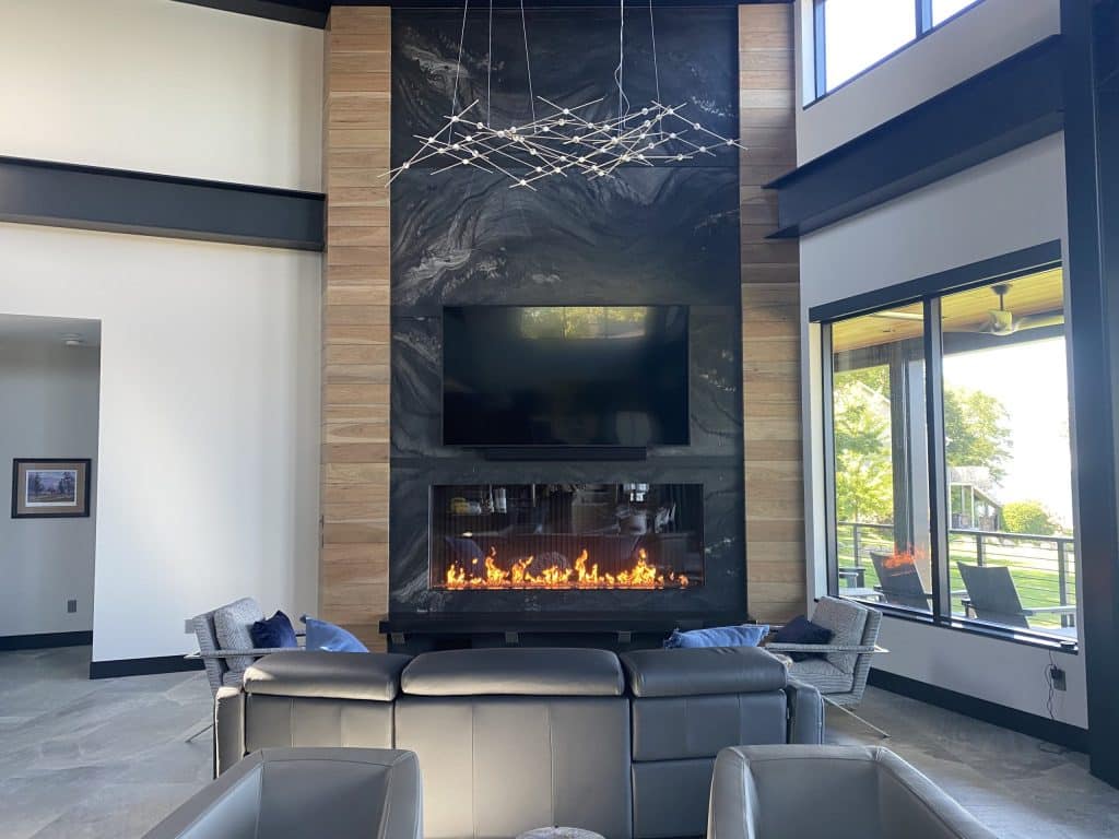 A stunning linear fireplace stretching wall-to-wall in a contemporary living space.
