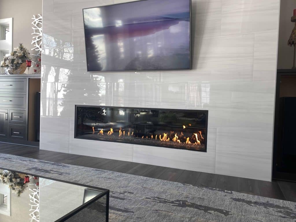 A smart gas fireplace controlled via a smartphone, integrated with a modern smart home system.