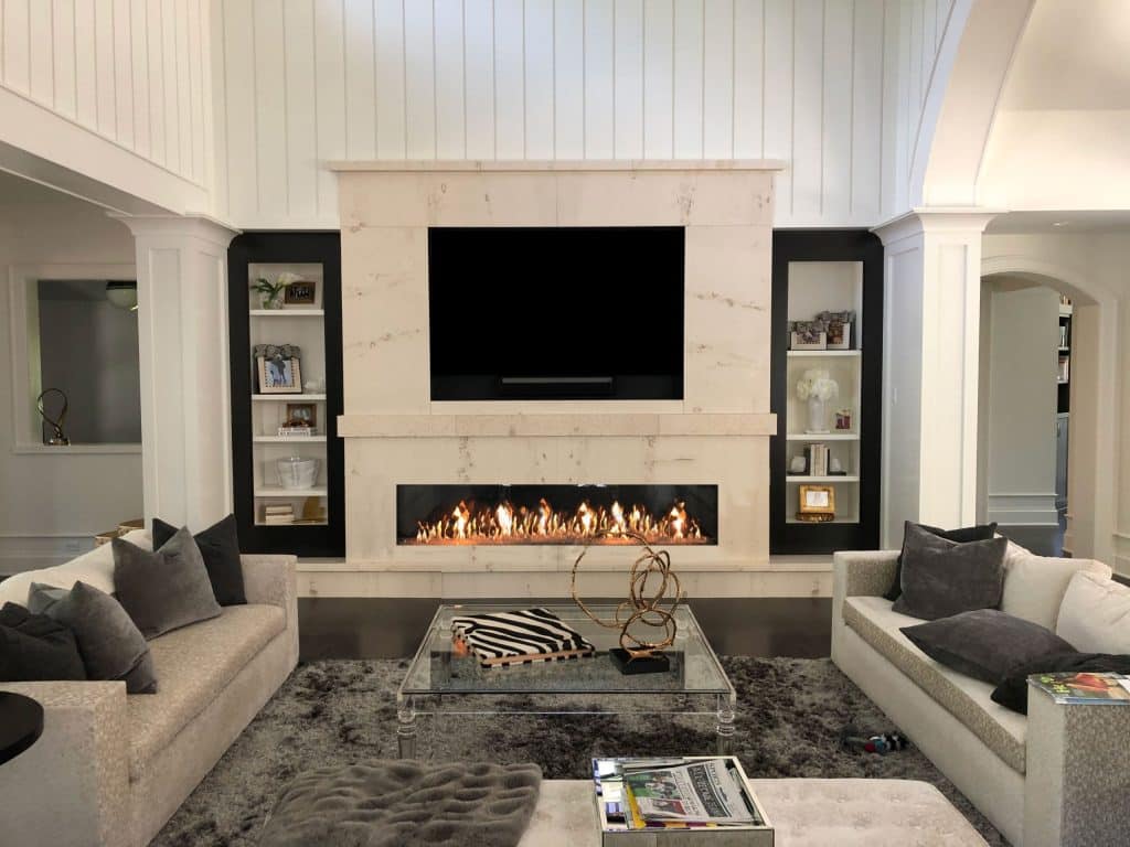 A custom wall integrated gas fireplace, creating a cozy and functional living space.