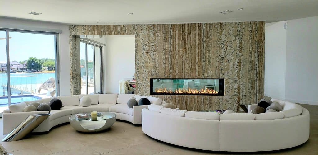 A sleek, minimalist gas fireplace with clean lines and an open-view design in a modern living room.