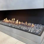 Acucraft Custom Front & Right View Gas Fireplace with Stone Media & Open View (1)
