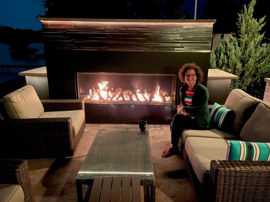 Acucraft Custom Outdoor Gas Fireplace with River Rock & Driftwood Logs (2) Modern outdoor patio with Blaze Outdoor Gas Fireplace.