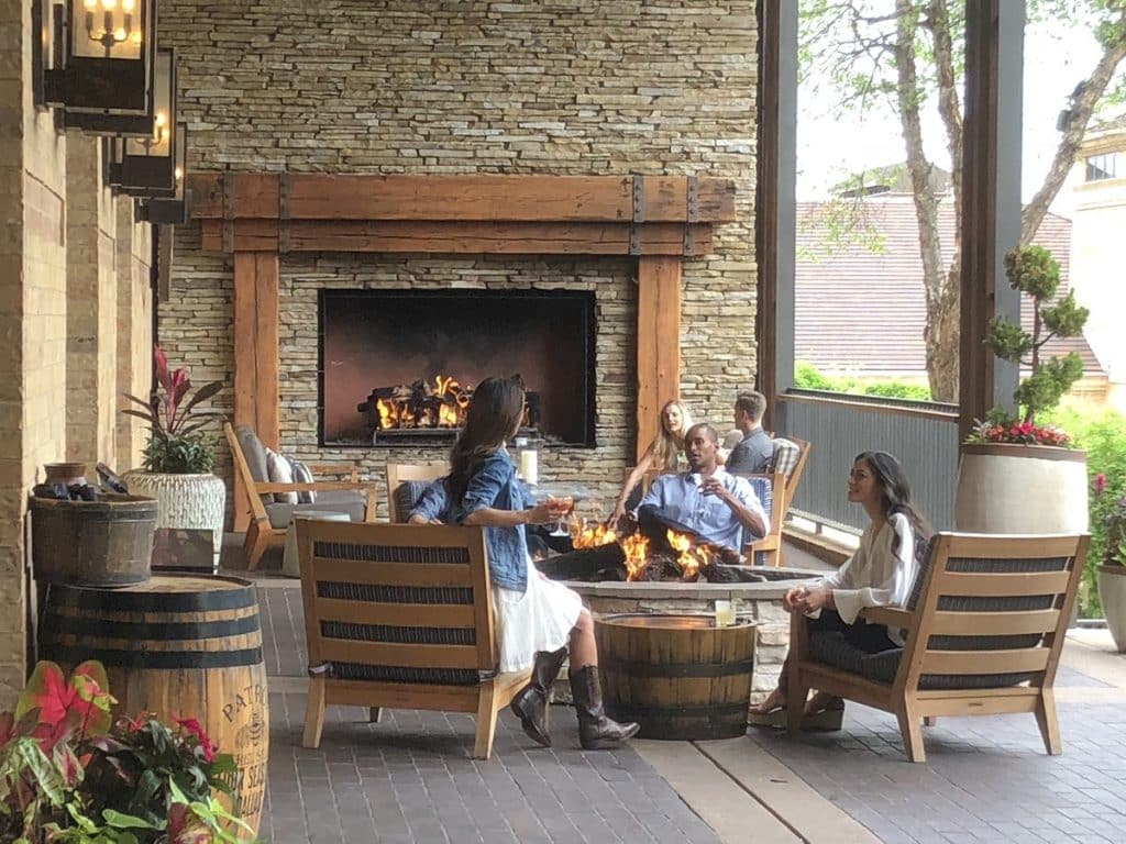 Acucraft Custom Outdoor Single Sided Open Fireplace with Log Set (11) Acucraft custom outdoor gas fireplace with a sleek design, creating a warm and inviting patio space for entertaining guests while enhancing property value