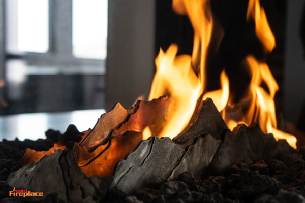 acucraft custom mountain burner in 3 sided gas fireplace