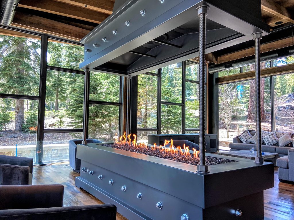 Acucraft Custom 4 Sided Gas Fireplace with Corner Posts (3) Industrial-style open-view gas fireplace by Acucraft in a luxury mountain retreat with panoramic forest views