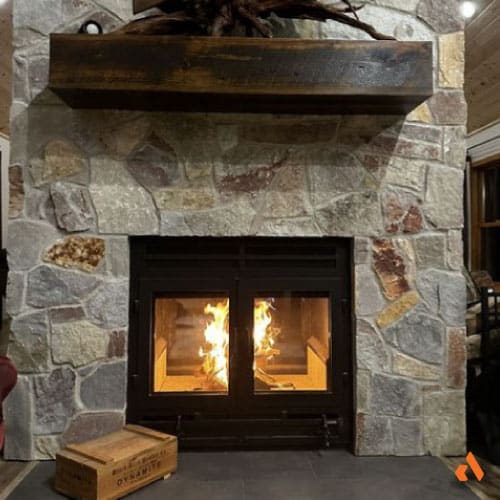 contemporary double sided see through wood burning fireplace in rustic living room