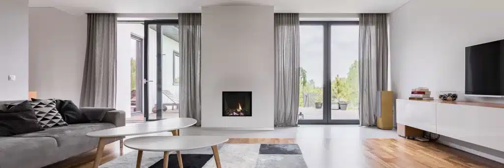 contemporary white living room with classic frameless direct vent gas fireplace with logs
