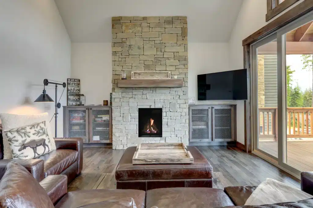 direct vent gas fireplace with tall viewing area and stone surround