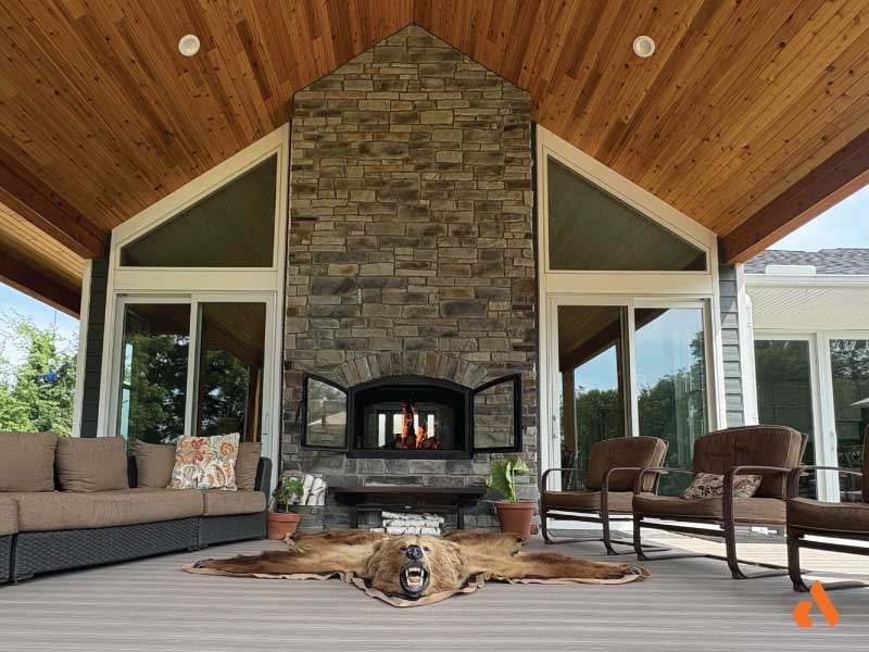 Joseph & Dianna DiJanni - Acucraft Hearthroom 44 Indoor Outdoor Wood Fireplace_Second Place inside outside see through wood fireplace on deck