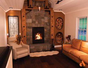Russ & Geri Featherby - Acucraft American Single Sided Wood Fireplace_Runner Up modern stone fireplace with tall viewing area and unique built in wood storage