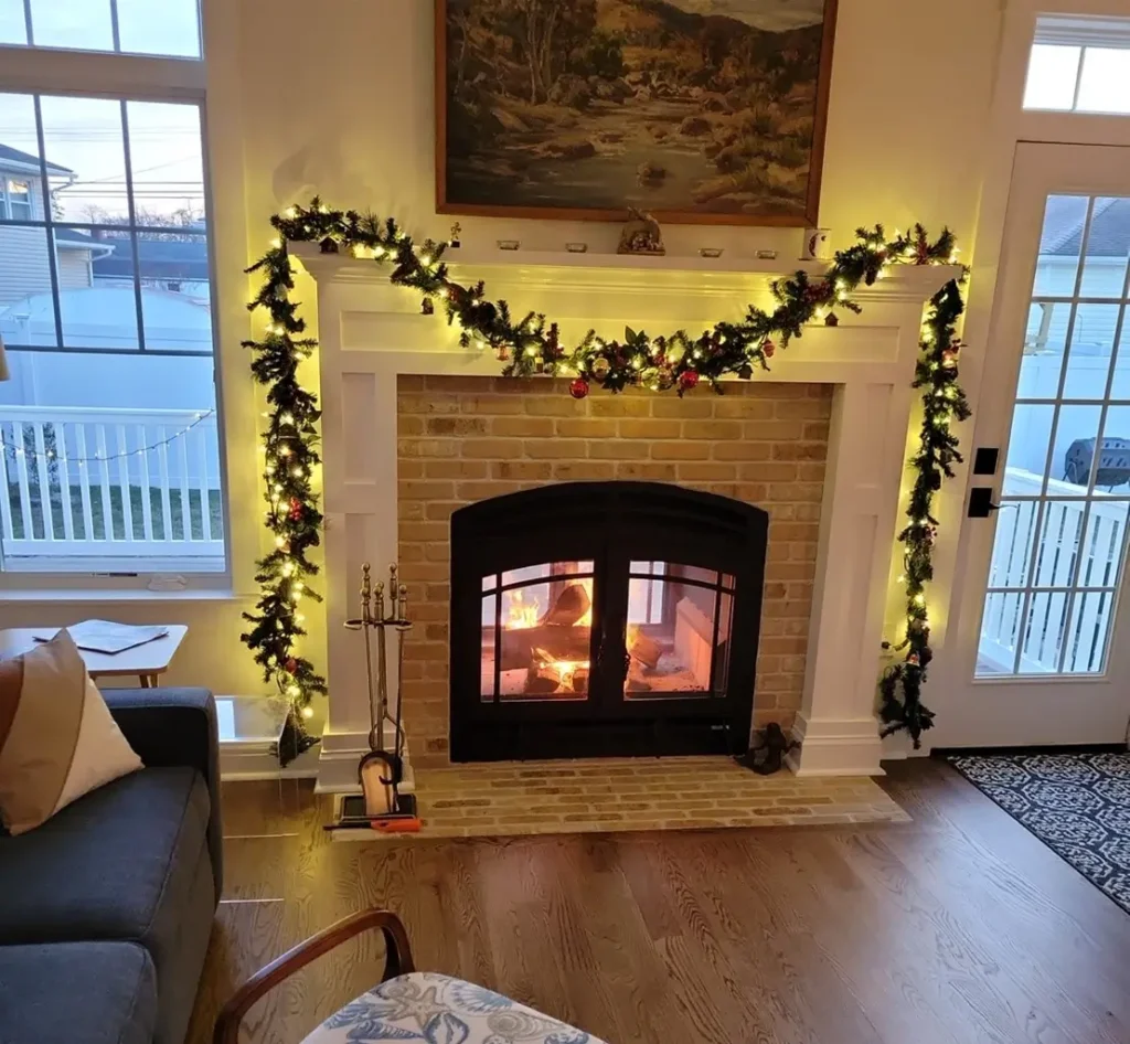 Festive-holiday-wreath-on-view-through-fireplace Festive-holiday-wreath-on-view-through-fireplace